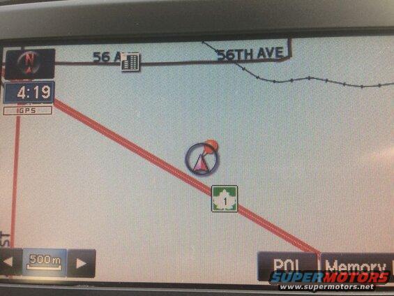GPS navigation screen showing a map with a route, time, and scale.