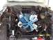 1978 Ford F-150 - The engine bay of a truck is shown with the engine partially disassembled and various wires exposed.