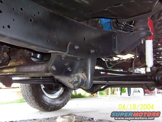 1978 Ford F-150 frame and suspension components, showing the front leaf spring mount and shock absorber