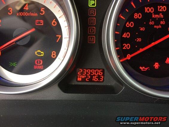 2009 Mazda CX-9 dashboard gauges showing odometer reading 239906 and trip 216.3.
