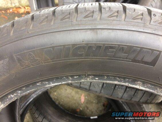 Michelin tire with brand name and Michelin Man logo