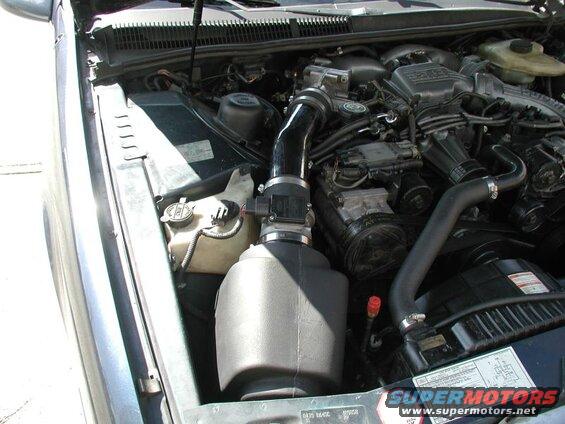 1990 Ford Thunderbird engine bay with cold air intake