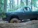 1979 Ford Bronco - Pickup truck stuck in mud during off-road excursion.