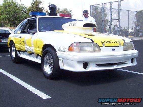 Modified Ford Mustang with "Glendale Police" markings and a large hood scoop