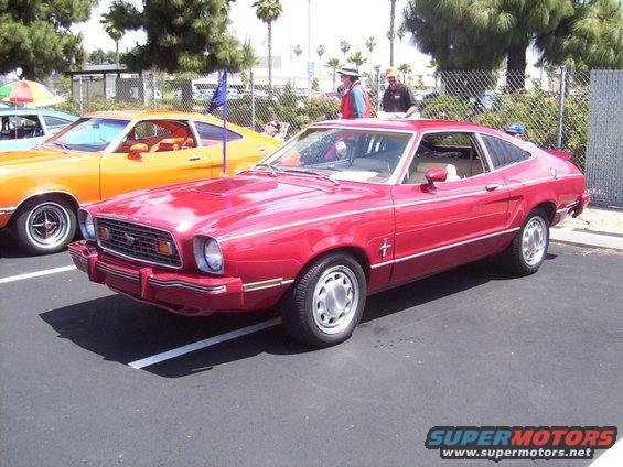 Red 1978 Ford Mustang II coupe with a chrome grille and Mustang emblem