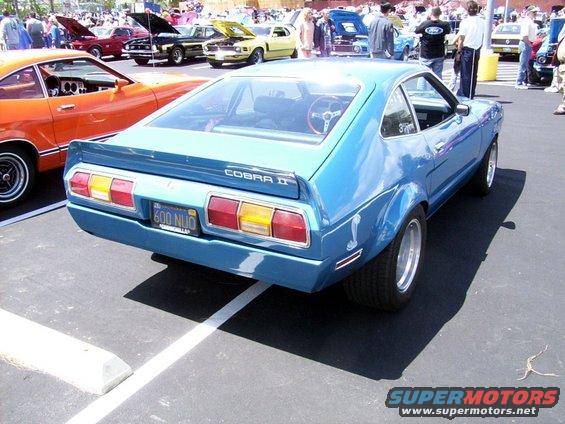 Blue 1978 Ford Mustang II Cobra II rear quarter view, showing Cobra snake decal and 'COBRA II' badging