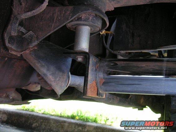 Chrome step bar mounted under vehicle chassis