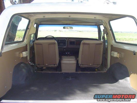 Interior view of a Ford Bronco showing front seats, dashboard, and cargo area