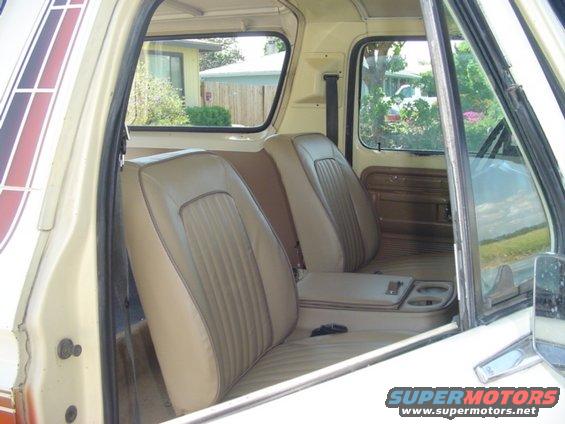 Interior view of a 1979 Ford Bronco showing front seats and center console
