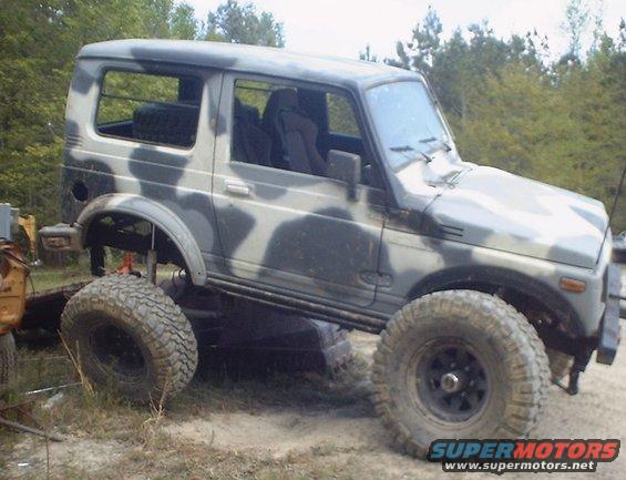Suzuki Samurai with camouflage paint and lifted suspension, off-road tires