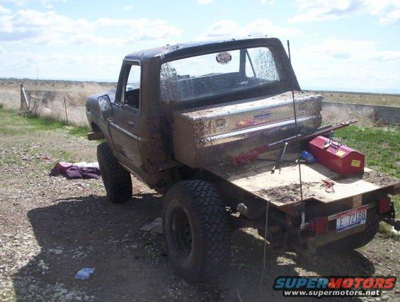 1978 Ford Bronco flatbed truck, rear view, with toolbox and tools on bed