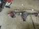 1993 Ford Bronco - Front axle assembly with disc brakes and red hub, likely for a truck or SUV.