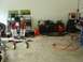 1993 Ford Bronco - Various automotive parts and equipment are organized and stored in a garage setting.