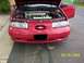 1995 Ford Taurus - This 1995 Ford Taurus is shown from the front with its hood open, revealing the engine compartment.