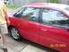 1995 Ford Taurus - Side view of a red 1995 Ford Taurus sedan, captured on April 25, 2004.