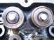 1984 Ford Bronco - Close-up view of valve springs and retainers within an engine block, showing mechanical components.
