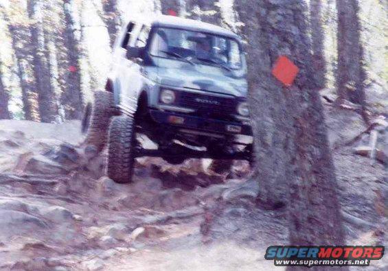 Suzuki Samurai climbing rocky terrain