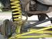 1979 Ford Bronco - Modified suspension components with yellow paint and a chain are visible in this close-up view.