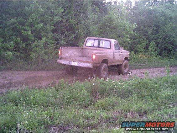 apr26723.jpg giving it gas and hitting brakes at the same time. i almost ran into a cut down tree (note limb in front of truck). i bet someone used it to get out of the hole.