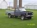 1988 Ford Ranger - This 1988 Ford Ranger pickup truck, seen in a rural setting, shows a two-tone paint scheme and its hood is open.