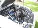 2002 Ford Mustang - The engine bay of a 2002 Ford Mustang is visible with the hood open, showing aftermarket modifications.