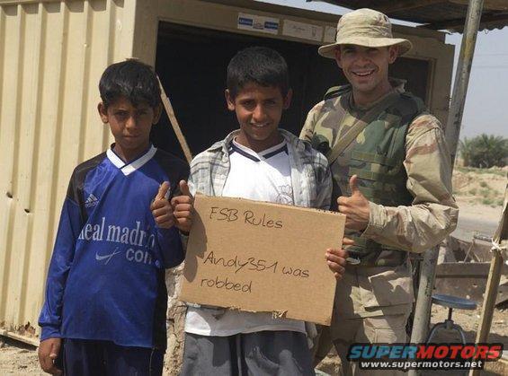 Cardboard sign reads 'FSB Rules Andy351 was robbed'