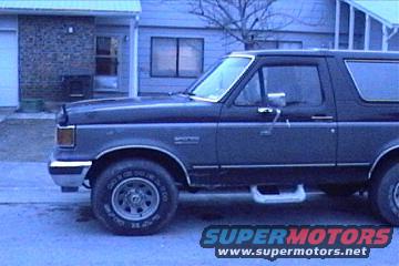 Side view of a dark gray 1989 Ford Bronco with a two-tone paint scheme