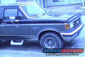 1989 Ford Bronco, front quarter view, showing side door, fender, and wheel