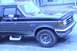 1989 Ford Bronco - This 1989 Ford Bronco is shown from the front quarter angle, highlighting its side profile and wheel.