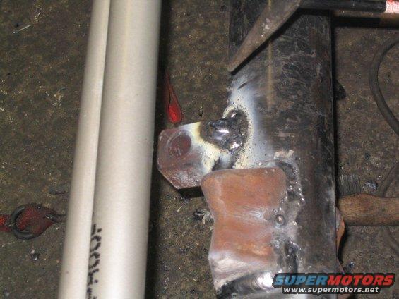 after about an hour of building up weld, the trac bar mount was done..