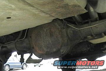 Rear differential and suspension of a vehicle; another vehicle visible in background