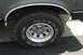 1989 Ford Bronco - This photo shows a close-up of a tire and wheel on a Ford Bronco, with visible text on the tire.