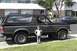 1989 Ford Bronco - This 1989 Ford Bronco is shown from the side with a young child standing next to it.