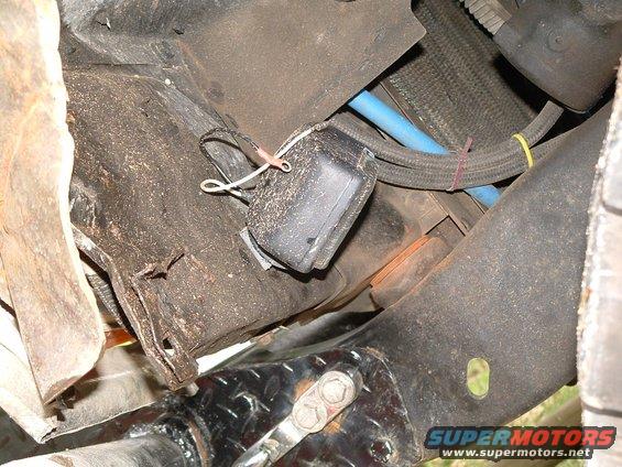 dscf0019.jpg found a hole in the core support, didnt have to drill. theres one on each side