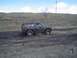1981 Ford Bronco - This 1980 Ford Bronco navigates a muddy off-road course, kicking up dirt as it goes.