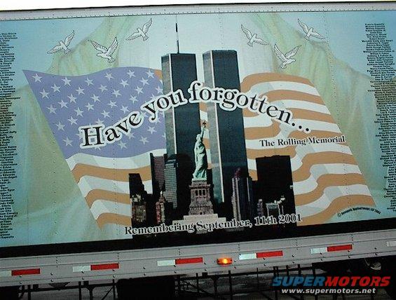 Trailer with 9/11 memorial artwork showing the Twin Towers, Statue of Liberty, and doves