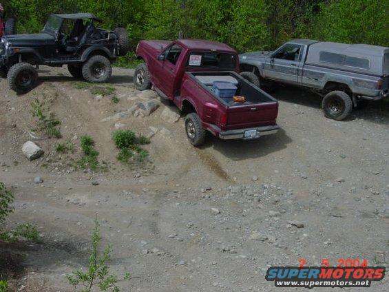 1992 Ford F-150 on a rocky trail with a Jeep and another pickup truck