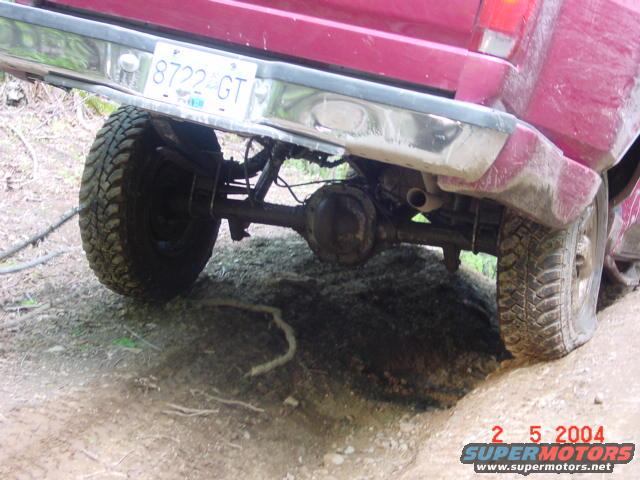 1992 Ford F-150 rear axle and tire, license plate 8722-GT