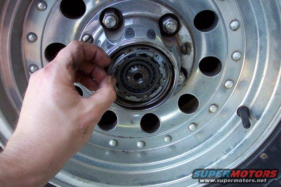 Slide the hub in, and install the large snapring in the groove