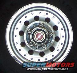 Aluminum wheel with six lug nuts and a red and silver center cap