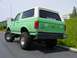 1990 Ford Bronco - Lifted 1990 Ford Bronco with a white removable top and custom rear bumper.