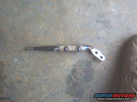 Metal bracket with two mounting holes and welded sections
