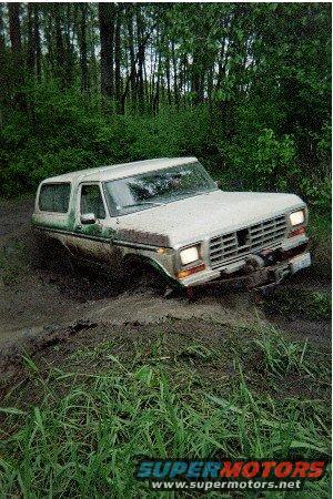 1978 Ford Bronco stuck in mud, front 3/4 view