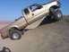 2000 Ford F-450 - This lifted Ford F-450 is shown navigating a steep dirt incline.