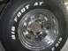 1979 Ford Bronco - Close-up of a BFGoodrich Big Foot AT tire mounted on a chrome wheel.