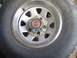 1979 Ford Bronco - A close-up view of a tire and wheel assembly, showing the tread pattern and rim details.