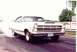1967 Ford Fairlane - White 1967 Ford Fairlane performing a burnout at a drag race event.