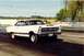1967 Ford Fairlane - White 1967 Ford Fairlane drag car with hood scoop and racing slicks on the track.