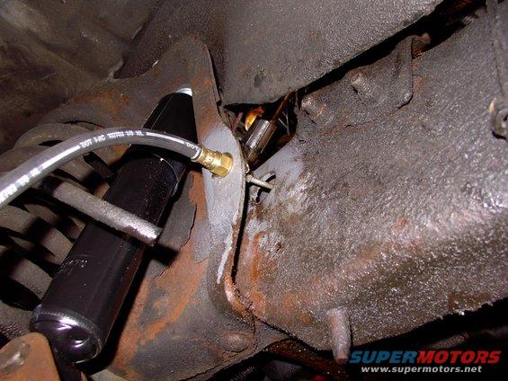 img_0073.jpg There's the new line passing through the frame rail going into the new hose.  20 more years out of her !