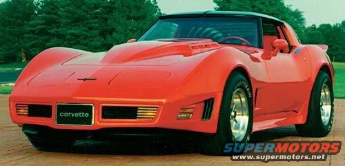 Red Chevrolet Corvette with a hood scoop and "corvette" badge, parked on a paved surface